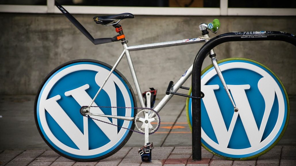 A bicycle with the logo of WordPress on the wheels